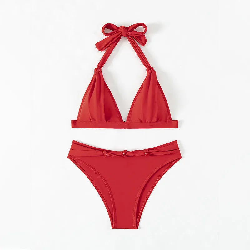 Red women's halterneck bikini with adjustable tie and high-cut shorts for swimming