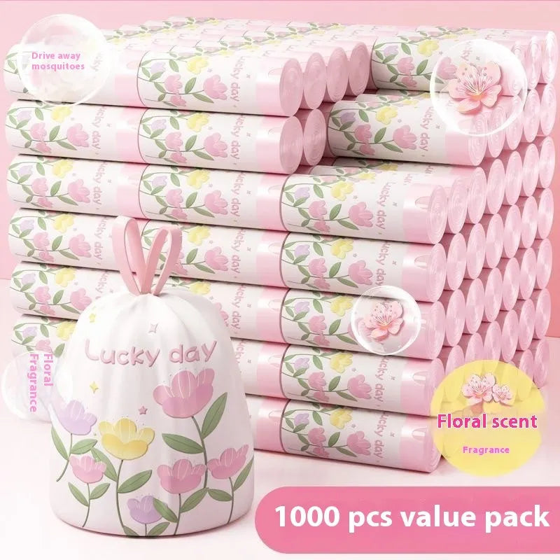 Pile of bold pink degradable drawstring garbage bags with argy wormwood.