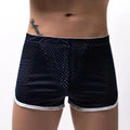 Men's black cotton blend boxer shorts with a mid-waist waistband laid flat.