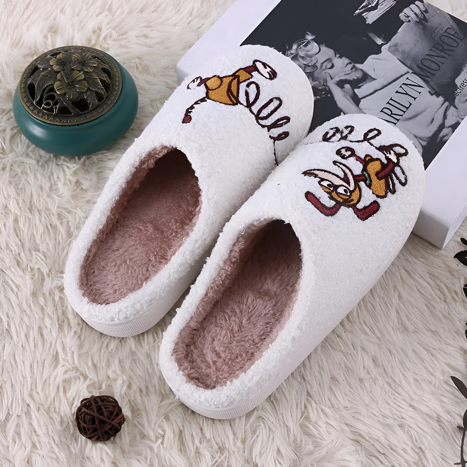 White fluffy cartoon slippers with a thick rubber non-slip sole and a toe holder strap.