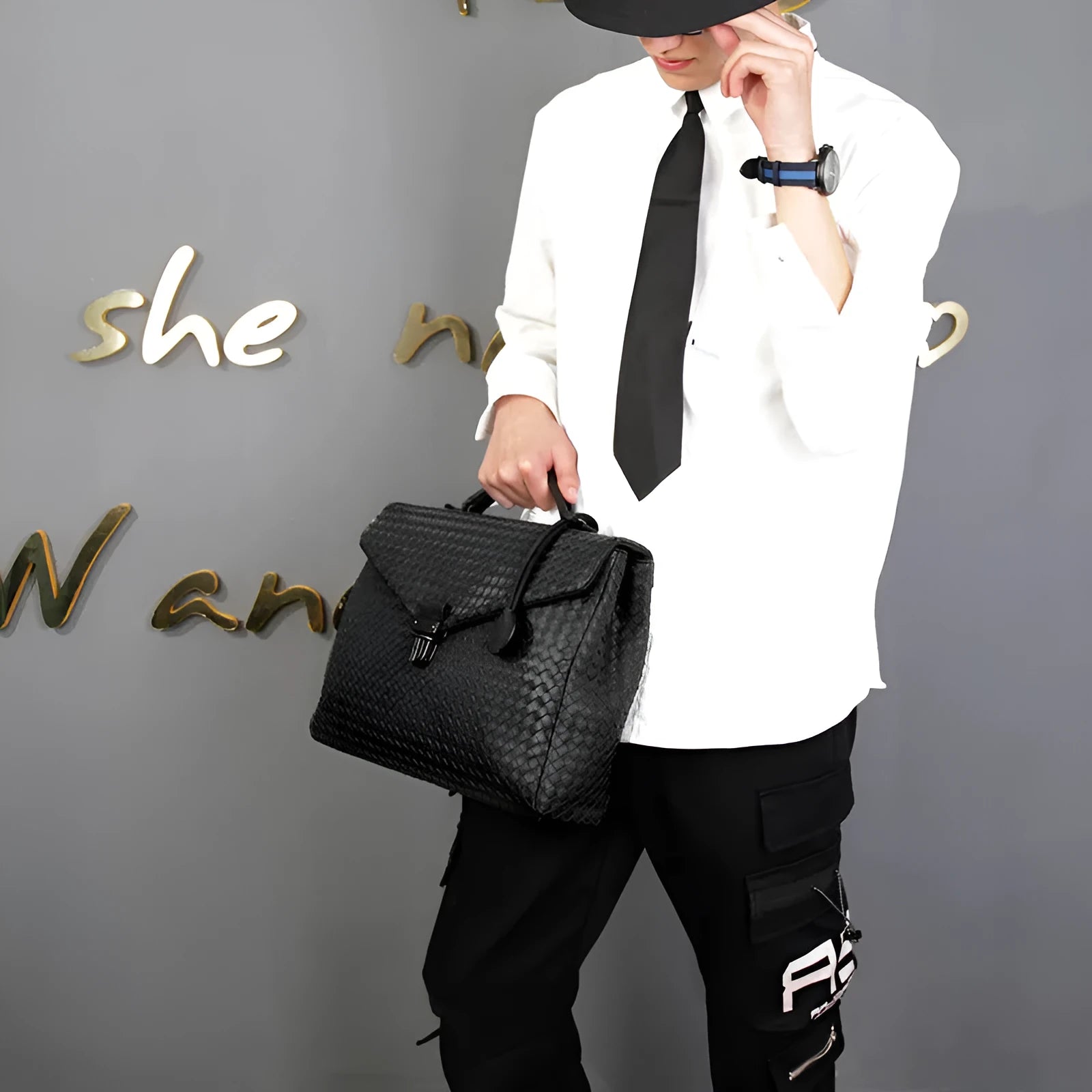Men's handbag in black super fibre synthetic leather with clamshell knitting pattern, horizontal square shape, latch closure, and soft handle