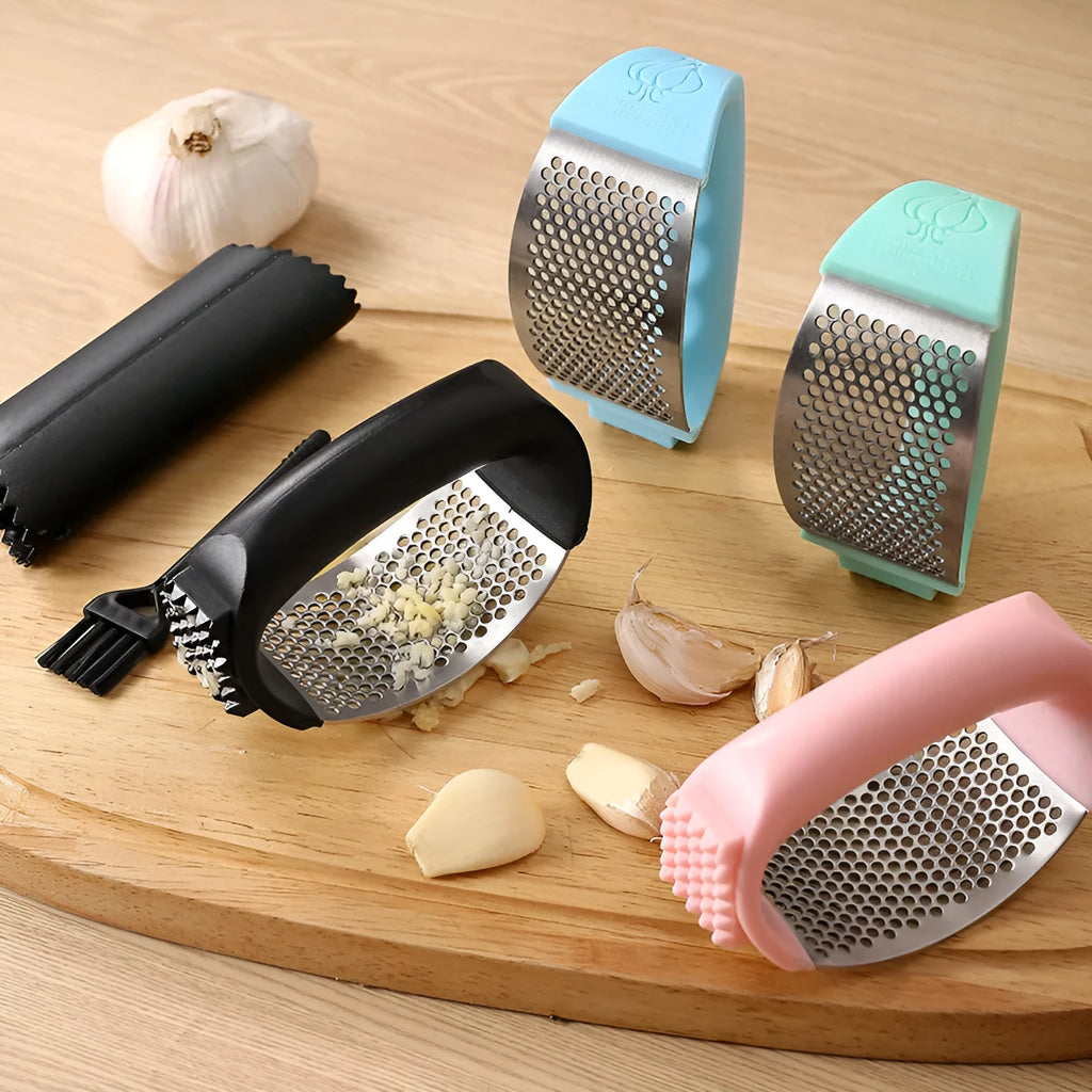 304 stainless steel garlic press in green, pink, black or blue measuring 11cm by 7cm