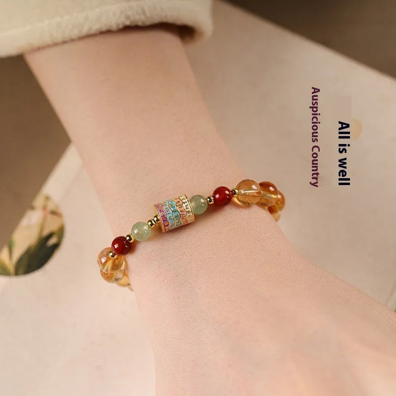 Yellow citrine bracelet with 8mm prayer wheel charm and round beads, retro women's jewellery.