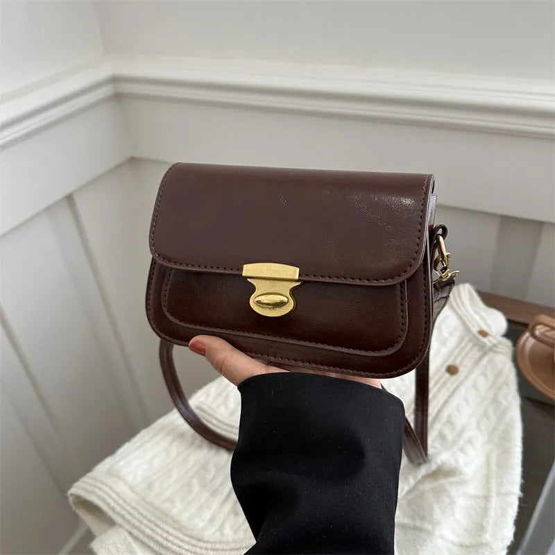Small retro square shoulder bag in soft PU leather showing horizontal rectangular shape