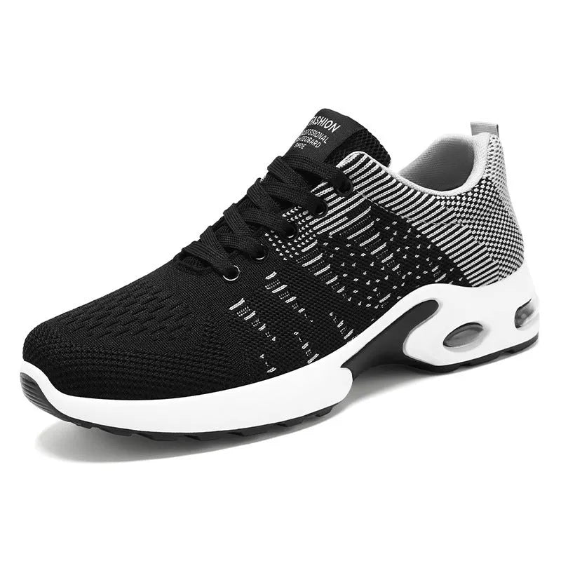 Men's low-top black and gray Flyknit mesh casual sneakers with lace-up front and round toe.