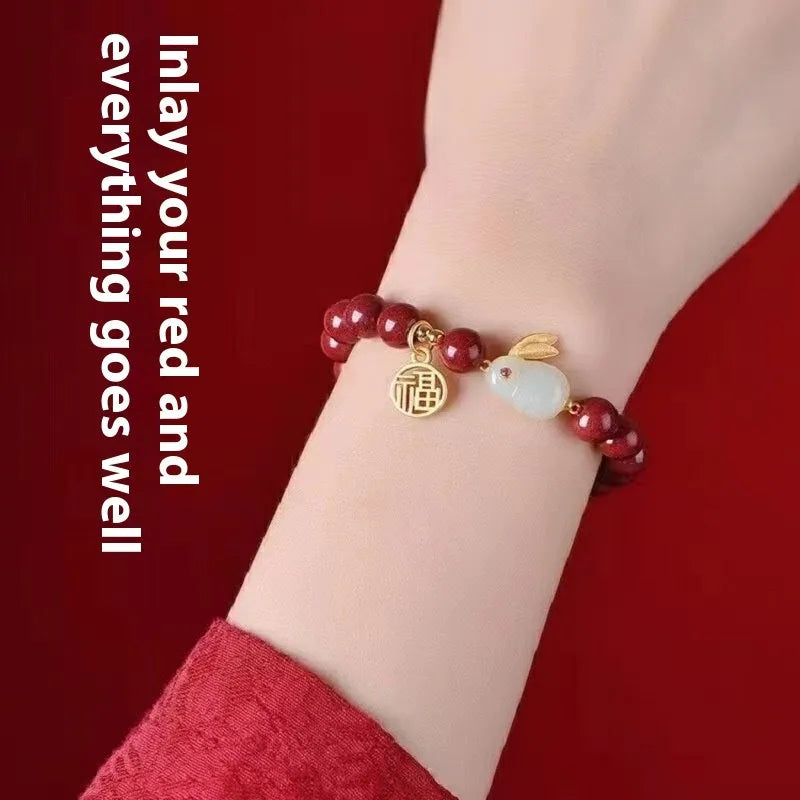 Purple gold sand cinnabar bracelet with jade hare charm in 6mm and 8mm bead sizes