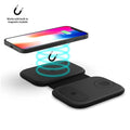 Magnetic wireless three-in-one foldable charger in black with iPhone, Apple Watch, and AirPods placed on charging zones