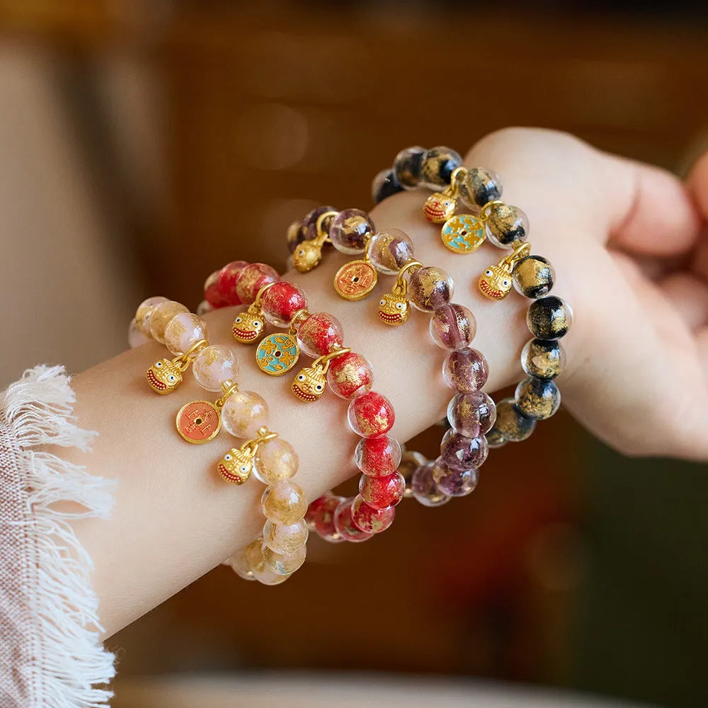Handmade national style bracelet with gold foil coloured glaze swallowing gold beast charm