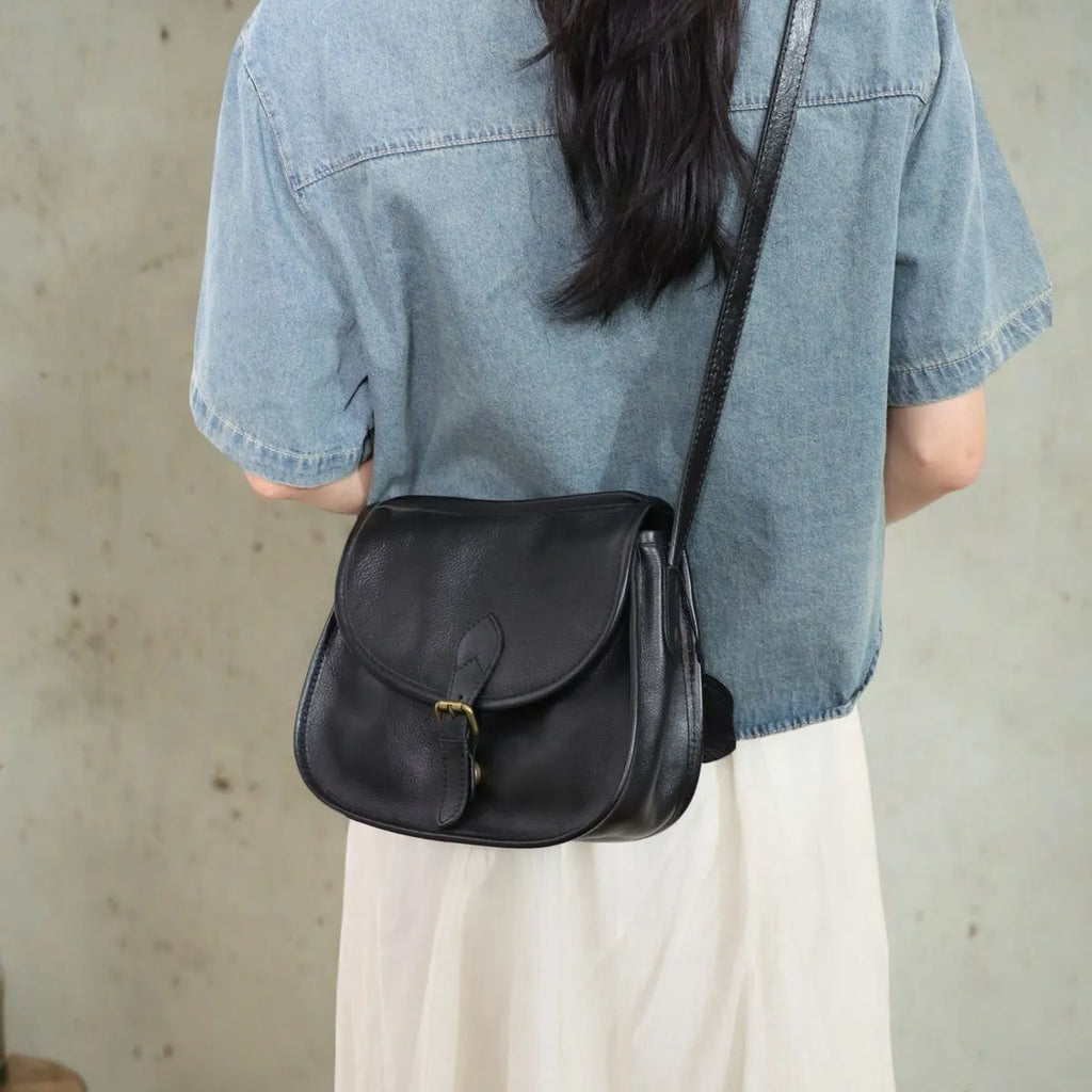 Brown genuine cowhide leather retro messenger bag with flap closure and crossbody strap