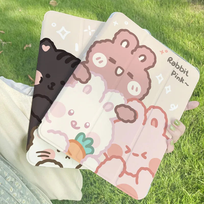 Flat tri-fold silicone iPad case with rabbit cartoon design on a table.