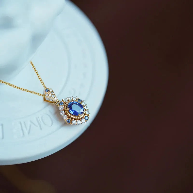 Yellow gold-coloured copper necklace with mixed gem inlaid pendant on a box chain, adjustable from 21cm to 50cm.