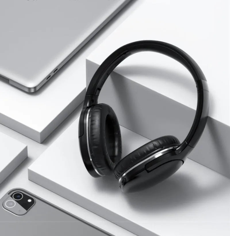 Black and white wireless Bluetooth sports gaming headset with subwoofer shown from the side.