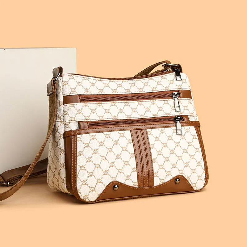 Brown stitching pattern crossbody bag with adjustable strap and polyester lining