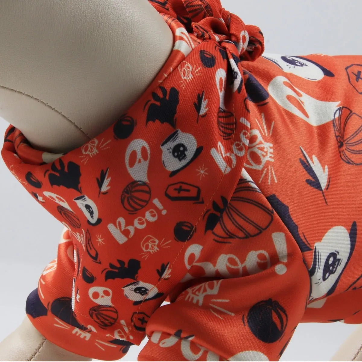 Wansheng fleece-lined dog sweater in an apricot colour with a matching triangular scarf, shown on a model dog.