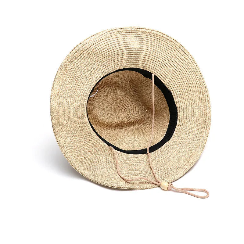 Men's foldable straw sun hat with wide brim in beige colour showing foldable design for summer outdoor use