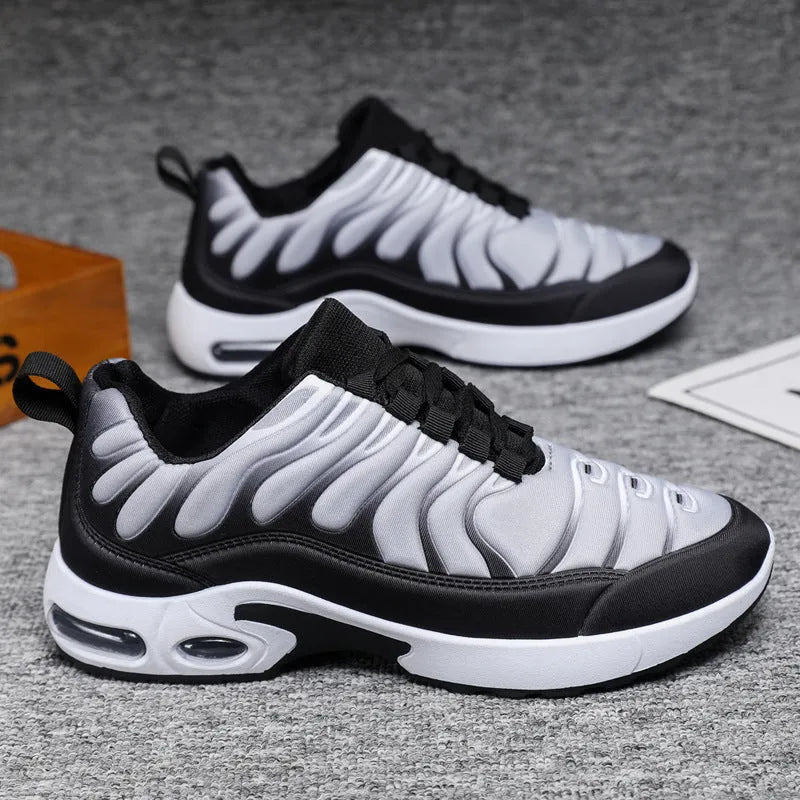 Colour-blocked lace-up sneakers for men with breathable fabric upper, rubber sole, and air cushion support in black and grey