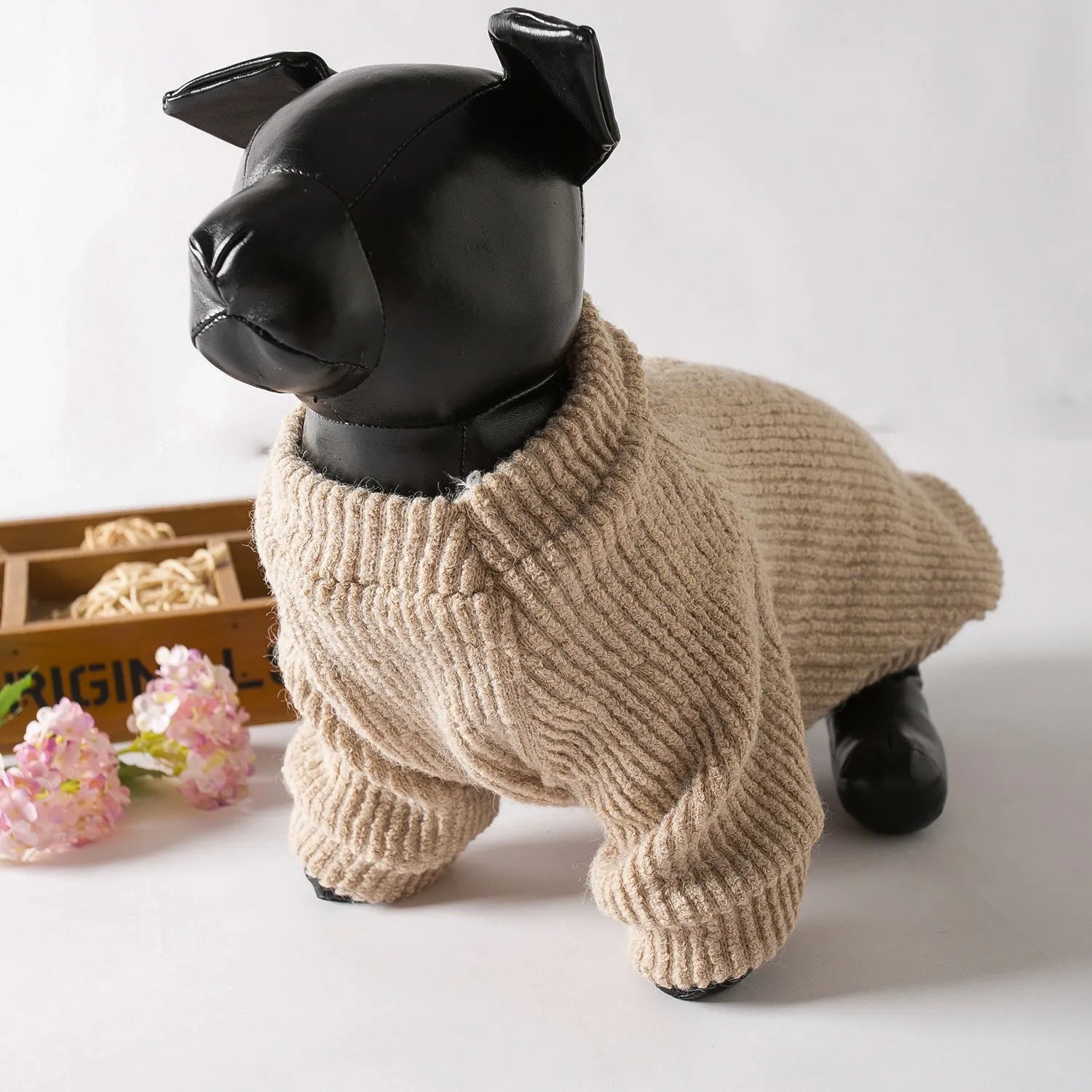 Brown cloth dog sweater pullover on a small breed dog.