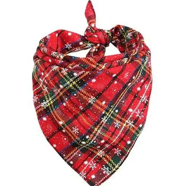 Cotton triangular dog scarf with plaid pattern in Christmas colours, 44x44cm, placed on a dog