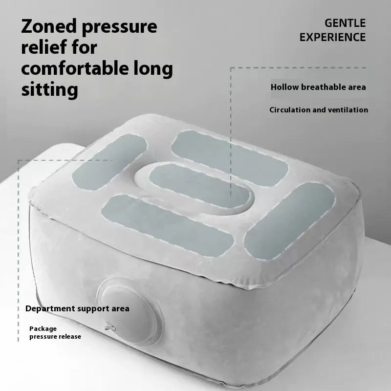 Grey inflatable seat cushion with a press valve, shown folded and inflated.
