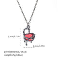 Dark Halloween necklace with bat and spider pendant designs on regular chain