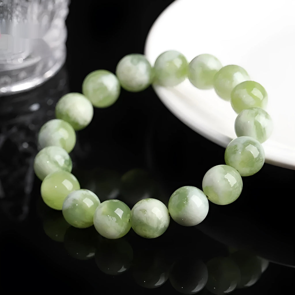 Green milk-in-water Xiuyan jade bracelet with geometric beads and polished finish