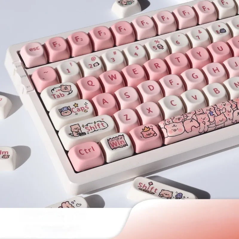 Pink fragrant pig design PBT plastic keycap for mechanical keyboards shown with keycap puller.