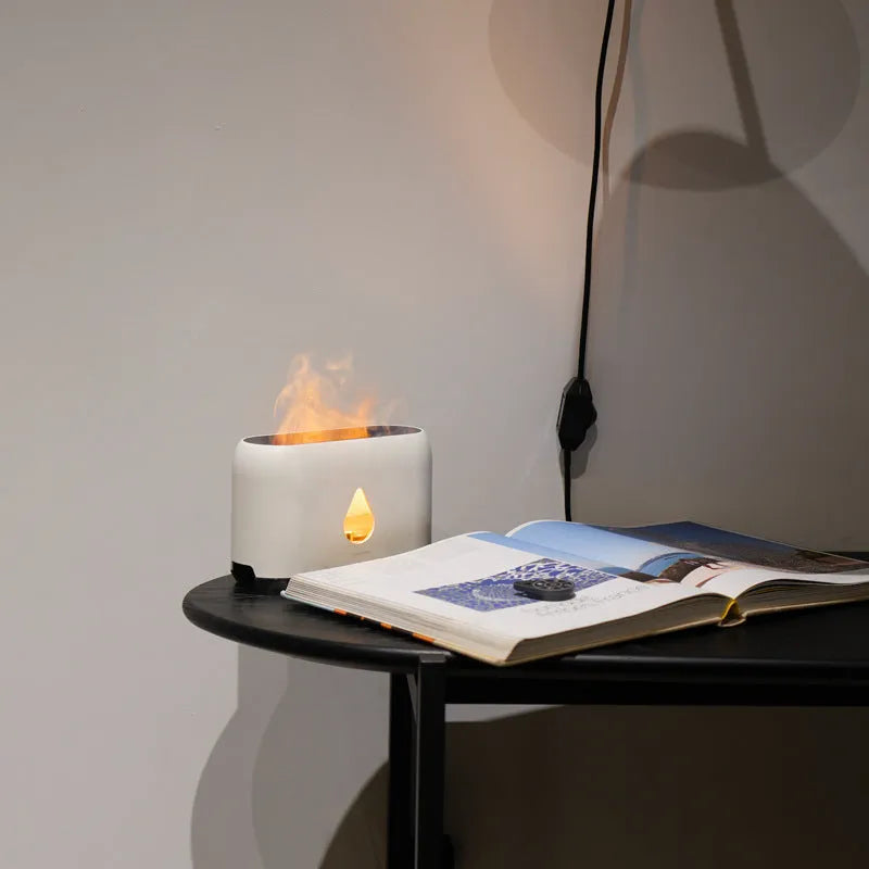 Mini remote control flame diffuser humidifier in white round plastic with single fog outlet and USB cable