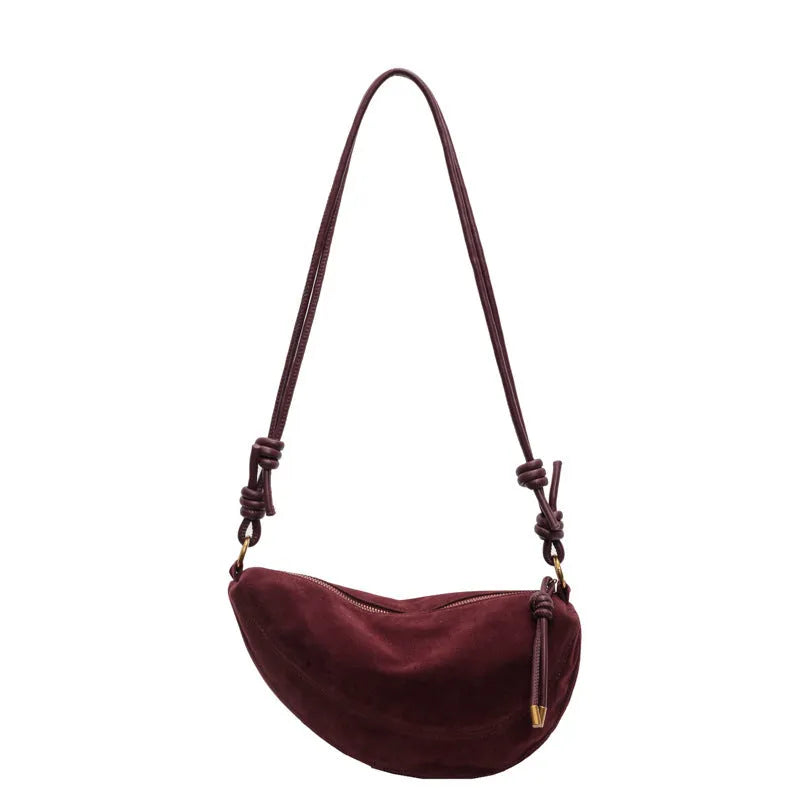 Soft PU crossbody underarm dumpling bag in black with visible sewing line detail