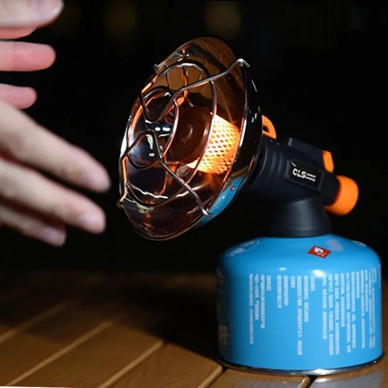 Black and orange portable camping heating stove with automatic ignition.