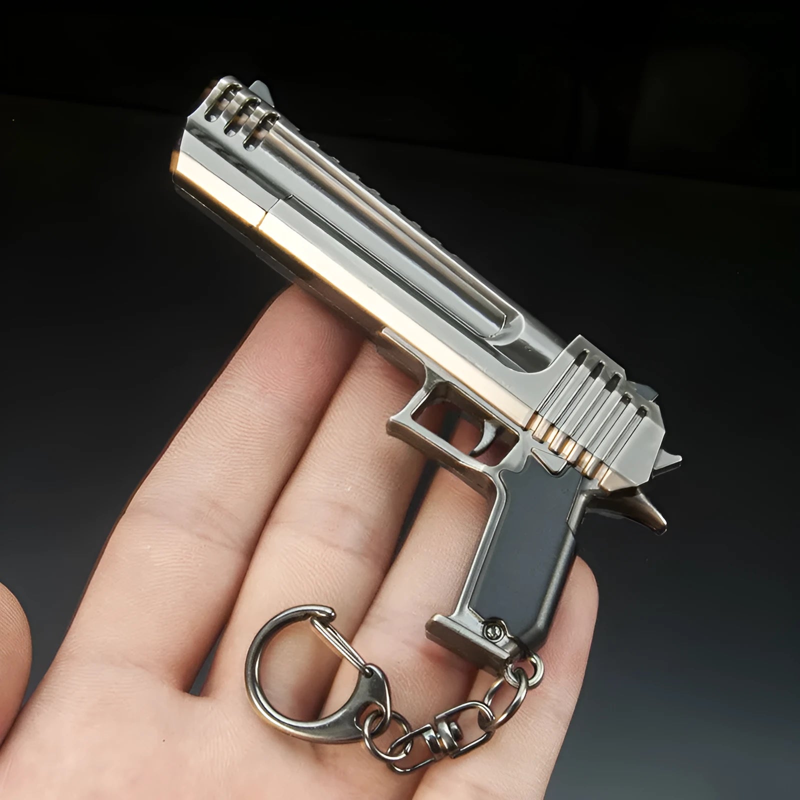 Cannon pistol keychain pendant zinc alloy black metal miniature replica key ring on black background