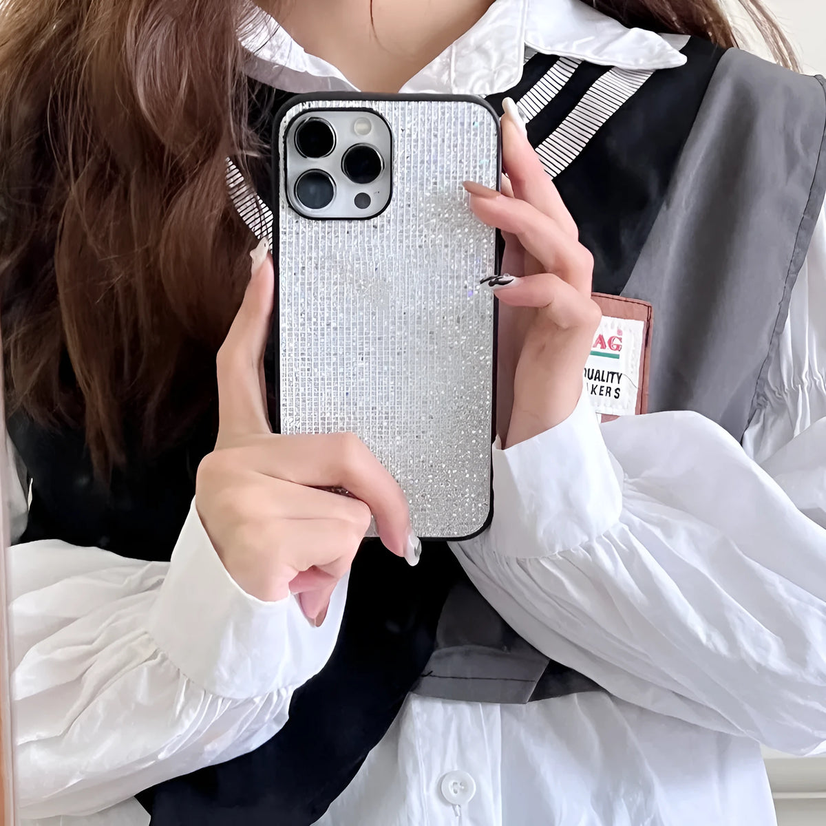 Rhinestone all-inclusive iPhone case in white or black with leather-style matte finish and fall prevention design.
