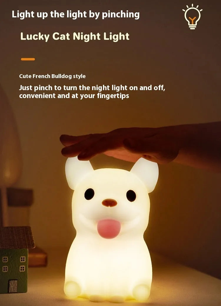 Silicone animal cartoon USB night light with Zodiac design on a bedside table.