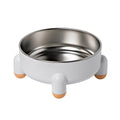Green ceramic-coated stainless steel pet bowl with non-slip base and raised high-foot design.