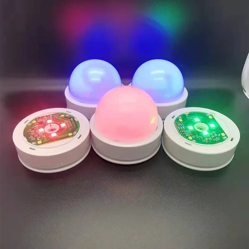 Colourful gradient 3D shooting night light with remote control on black surface