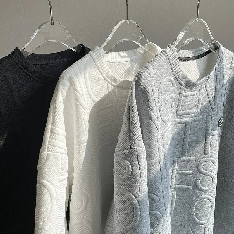 Man modelling a grey loose-fit retro T-shirt with a raised 3D summer letter print on the front.