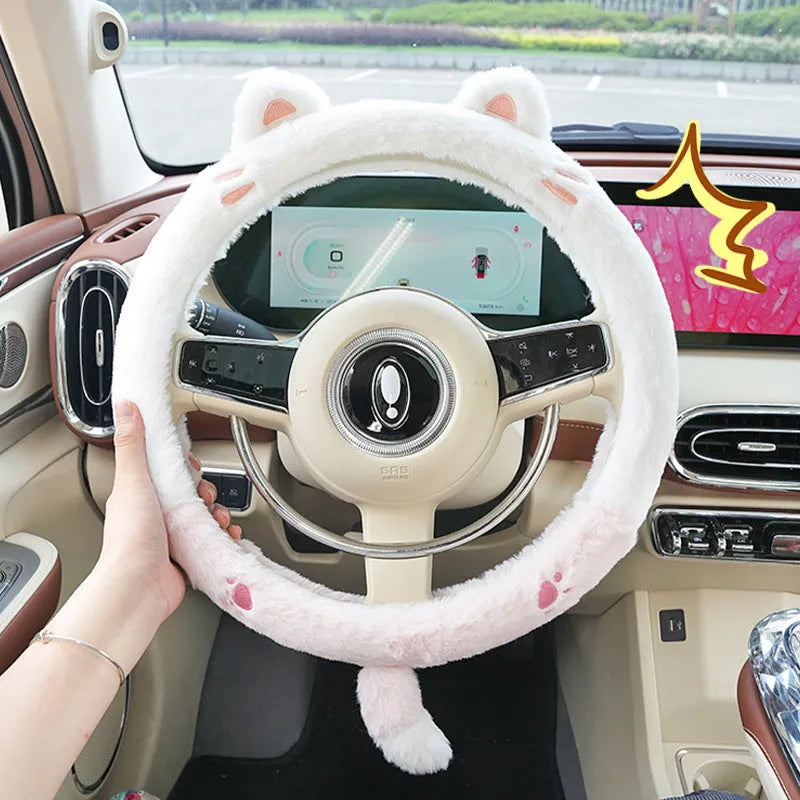 Plush faux fur steering wheel cover with embroidered cartoon bear face, fitted on a car steering wheel