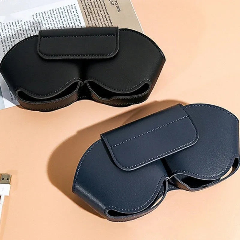 Black PU leather protective case for AirPods Max headphones with the lid open, showing internal sleeves.