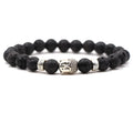 Natural stone stretch bracelet with round 8mm beads on a black background, showing Tigereye and turquoise colour options.