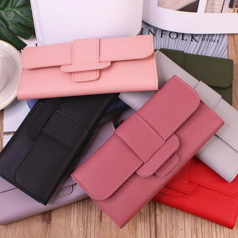 Women's long tri-fold clutch wallet in solid colour with sewing thread detail, PU leather exterior, large capacity