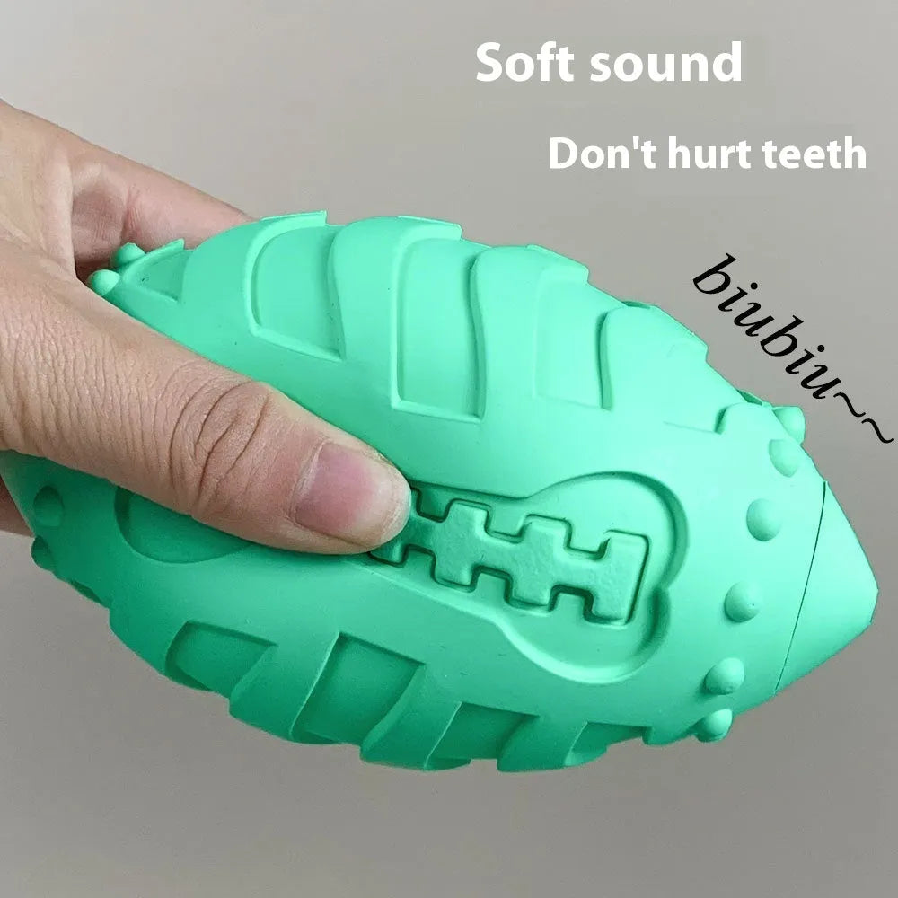 Light green rubber rugby ball dog toy with interactive vocal features for teeth cleaning play