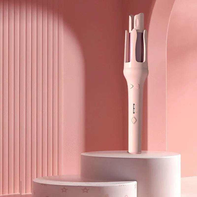 White and pink automatic hair curler with 32mm rotating barrel on a table