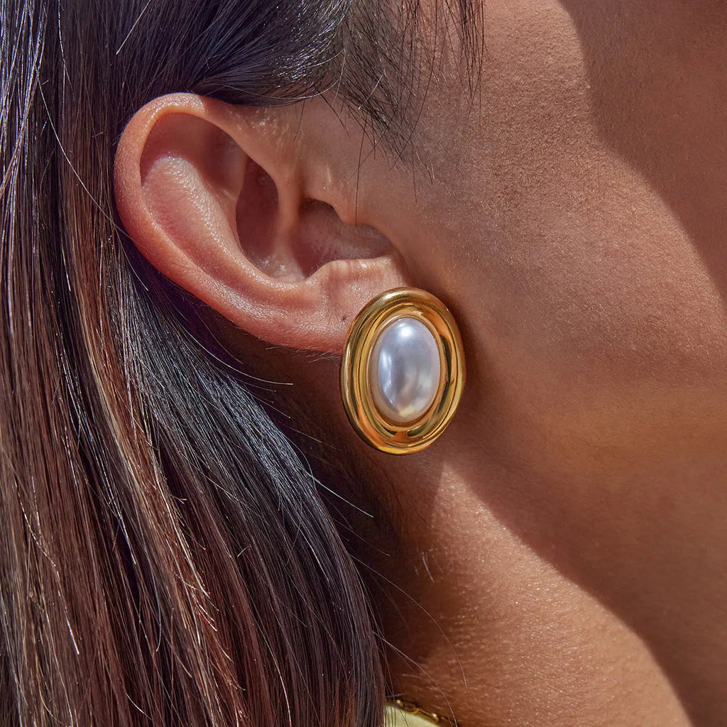 Close-up of women's stainless steel vintage pearl stud earrings with a 10mm white pearl.