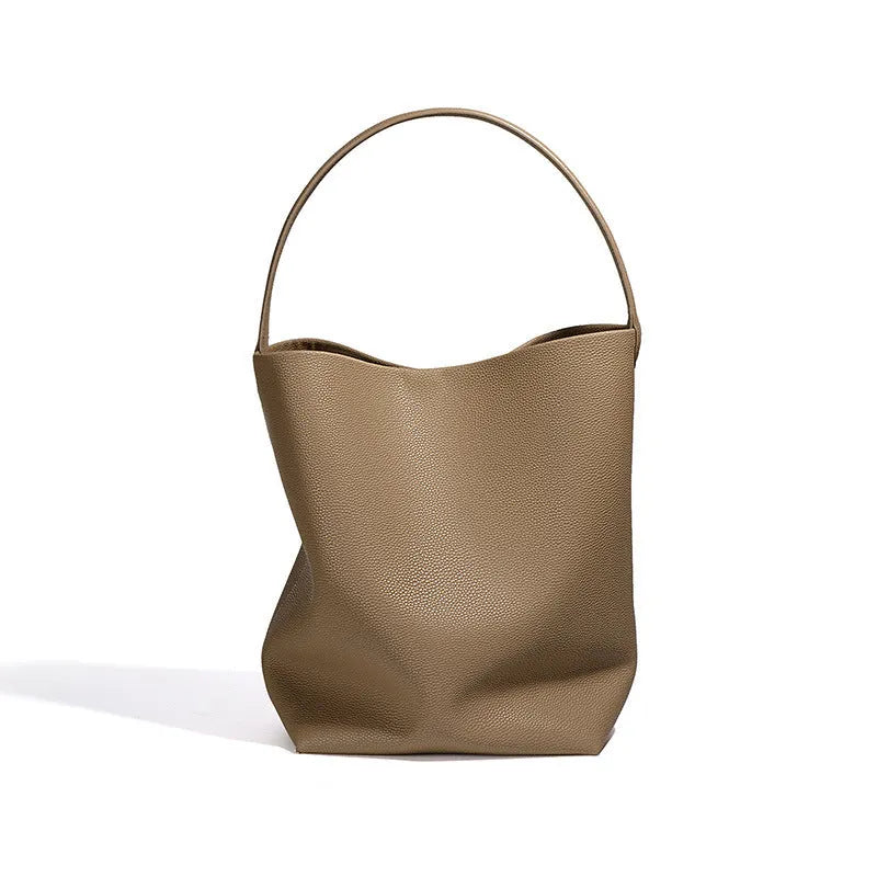 Genuine leather bucket bag for women in soft construction with open pocket and patchwork detail