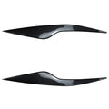 Pair of Ford Focus front headlight eyebrow stickers in black finish on car