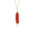 Copper wire winding red crystal hexagonal prism pendant necklace with water wave chain on display