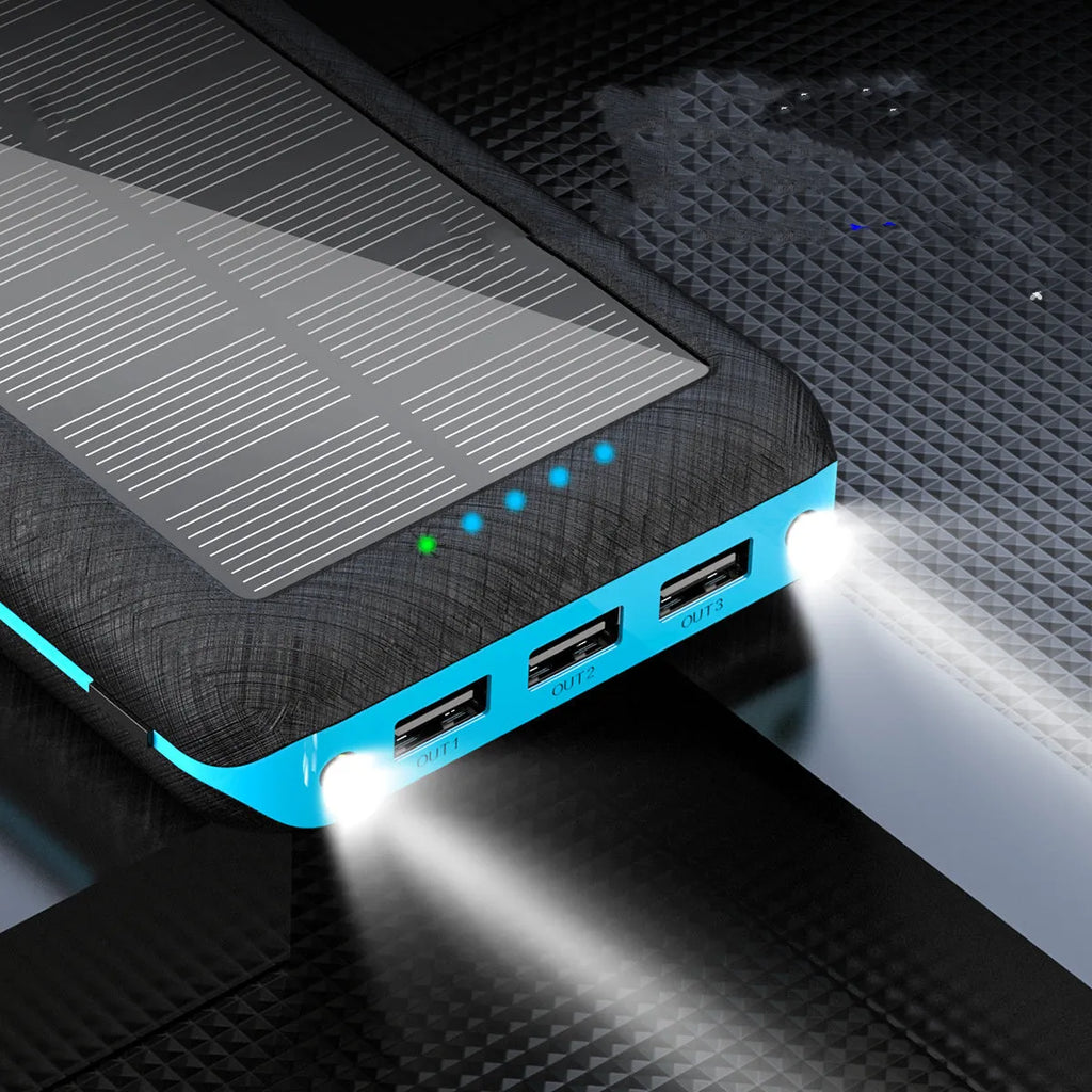 Wireless power bank with Qi charging showing three USB ports and LED flashlight in black-blue colour
