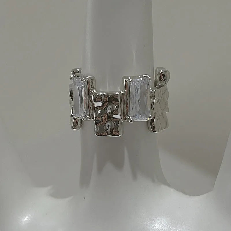 Geometric open ring with zircon stones and silver-plated finish