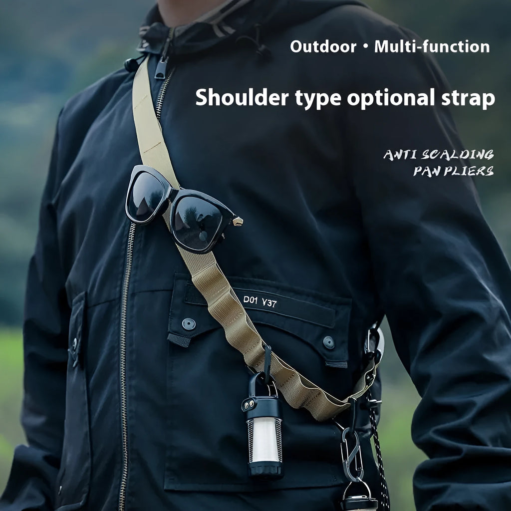 Black 130cm long woven rope hanging strap shown coiled, for use as a clothesline or storage belt.