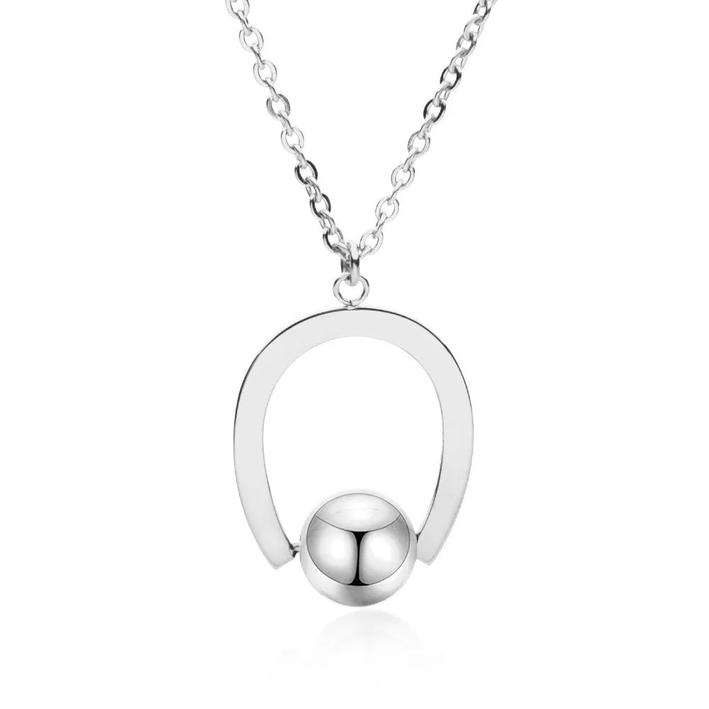 Adjustable stainless steel necklace with geometric pendant on a cross chain, shown in gold colour.