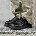 Black low-top platform shoes with round toe cap and rubber sole for men and women.